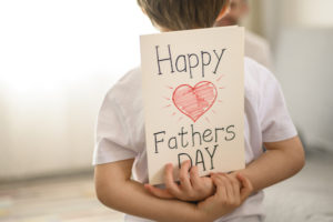 happy fathers day kid with card