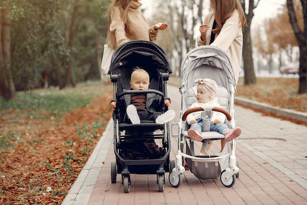 Two young mothers with babies