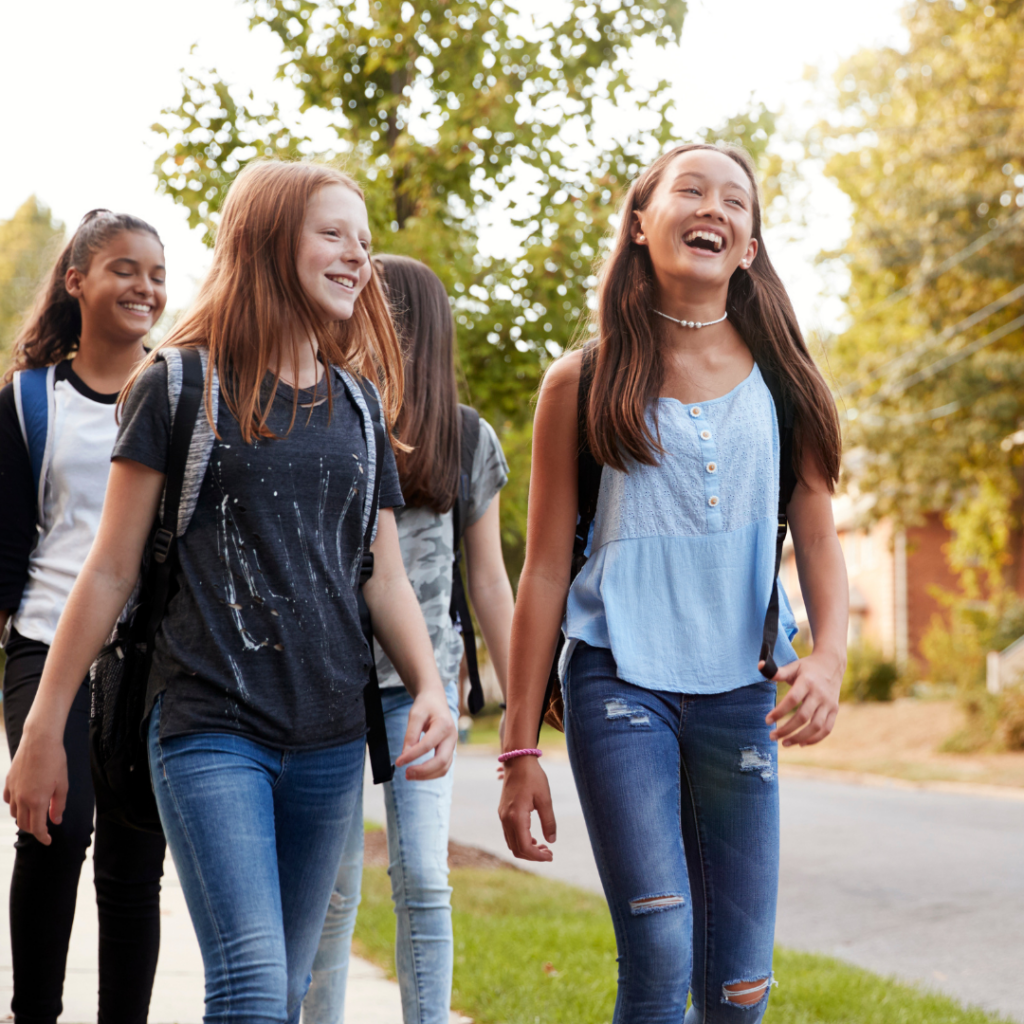 adolescent girls walking home